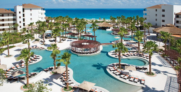 Secrets Playa Mujeres pool with the ocean in the background.