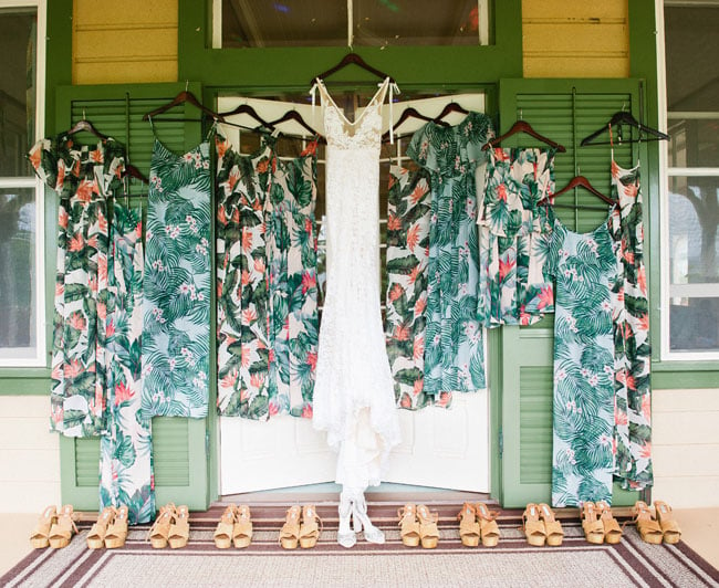 Wedding dress with Bohemian floral bridesmaid dresses and sandals.