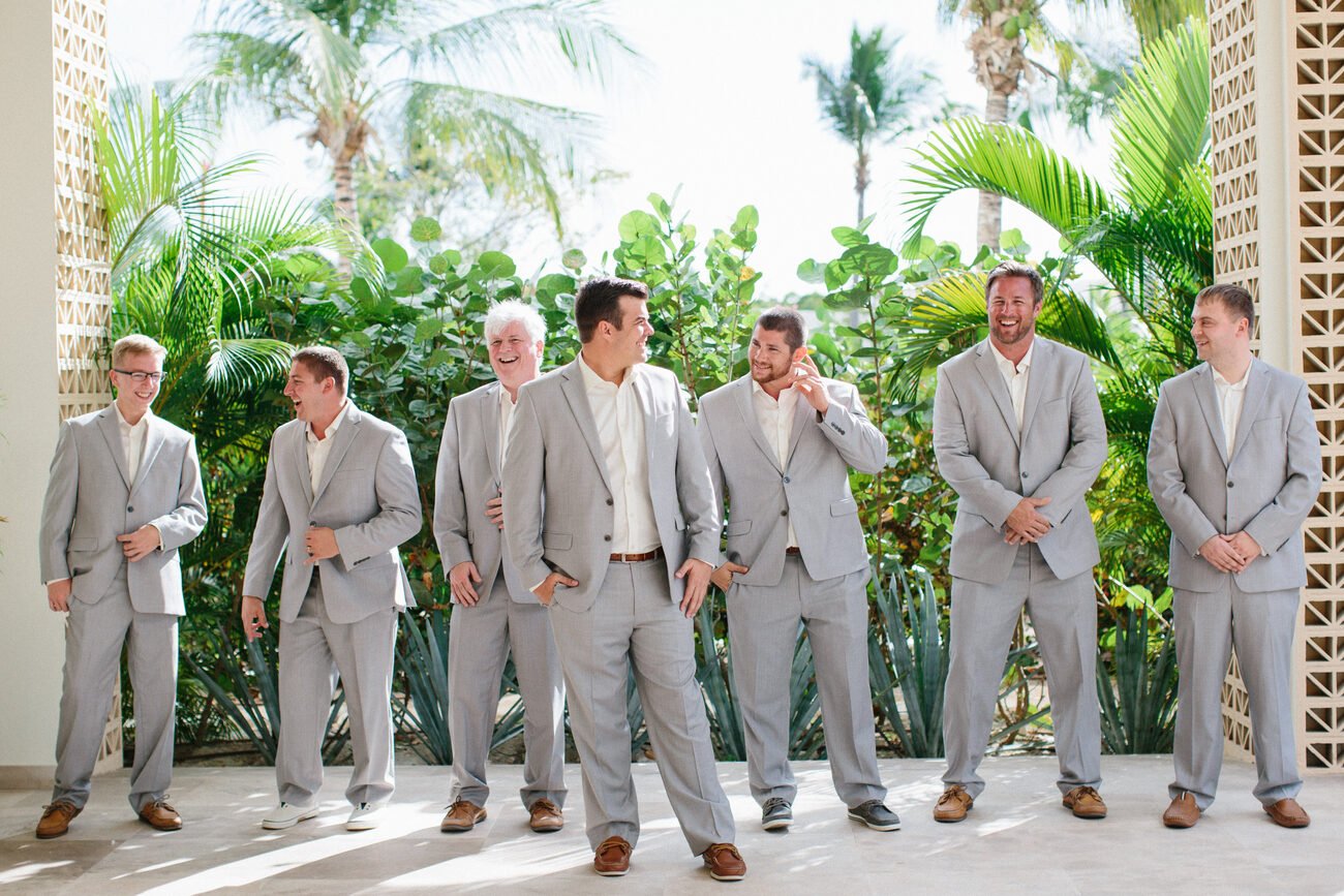 Grey suit wedding day attire inspiration for groomsmen. 