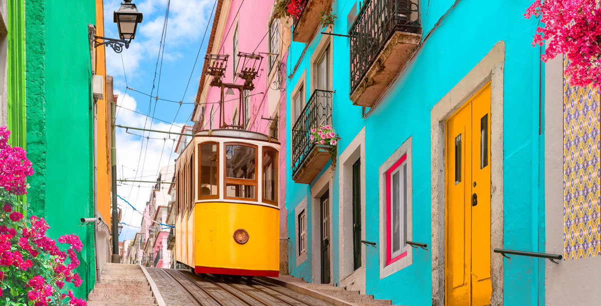 Yellow tram on a street in Lisbon