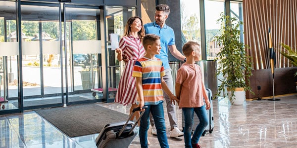 Family walking into hotel